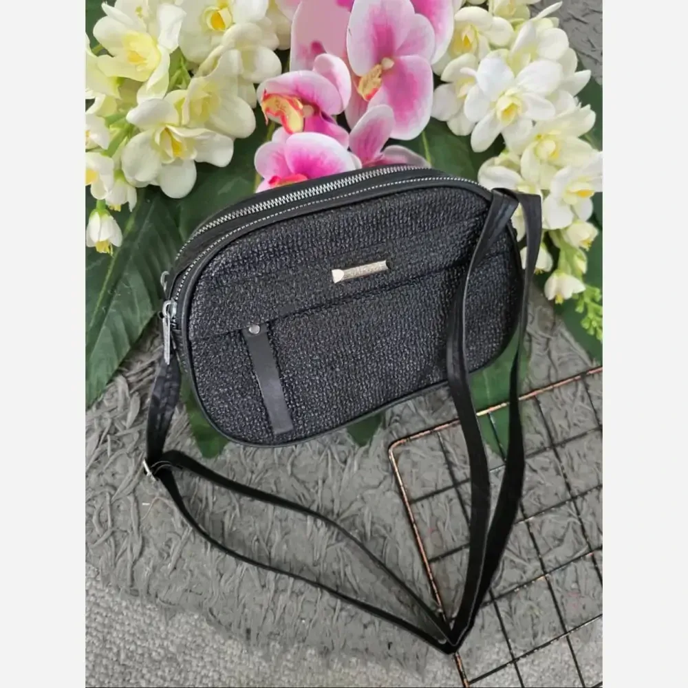 کیف زنانه آیدا جنس چرم طرح کنفی سه خانه رنگ بندی متنوع